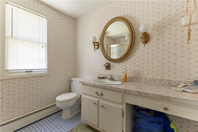 8295 Mentorwood Dr, Mentor, OH 44060 - bathroom with baseboard heating, plenty of natural light, tile patterned flooring, vanity, and wallpapered walls