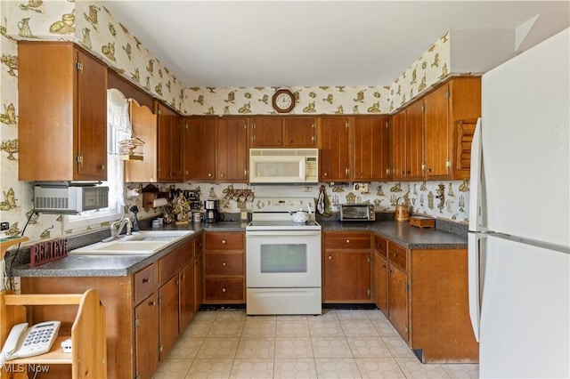 8295 Mentorwood Dr, Mentor, OH 44060 - kitchen featuring white appliances, a sink, dark countertops, wallpapered walls, and brown cabinets