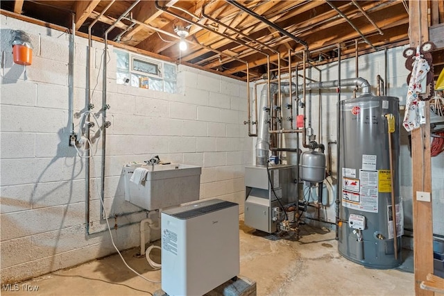 8295 Mentorwood Dr, Mentor, OH 44060 - utility room with gas water heater, a heating unit, and a sink