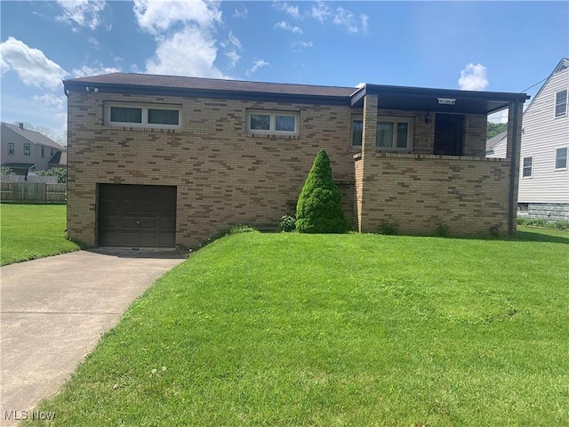 view of front facade with brick siding, an attached garage, and driveway