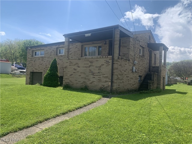 view of property exterior featuring a lawn, brick siding, and an attached garage