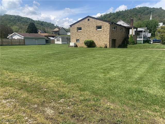 view of yard with central air condition unit