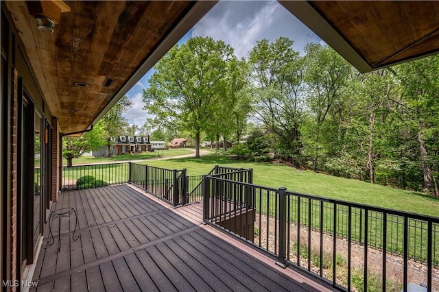 wooden deck with a yard