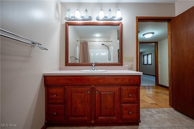 bathroom with vanity, tile patterned floors, and a shower with shower curtain