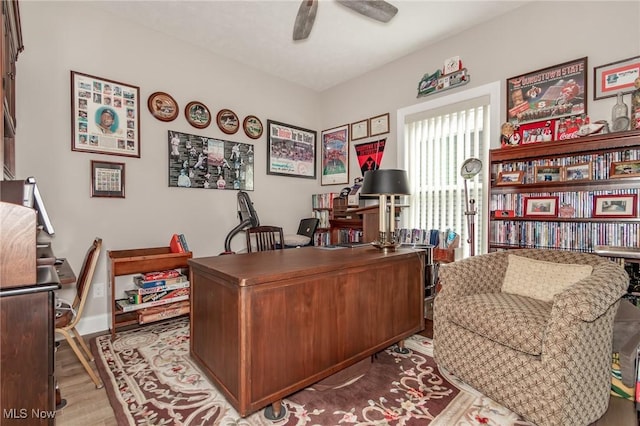 office area with ceiling fan and wood finished floors