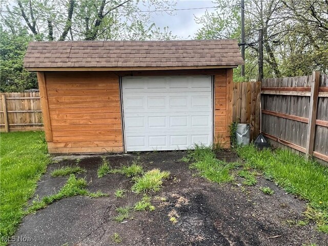garage with fence