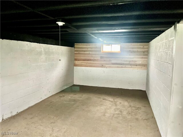 basement featuring concrete block wall