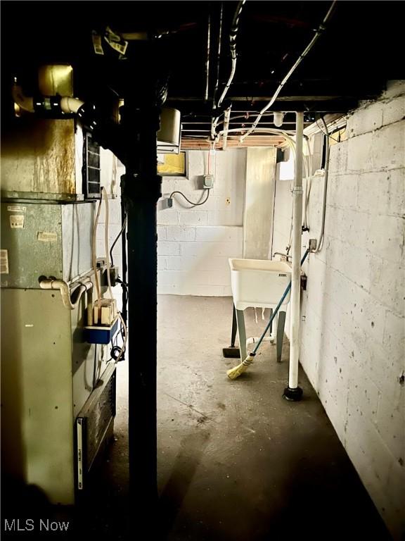 unfinished basement with a sink