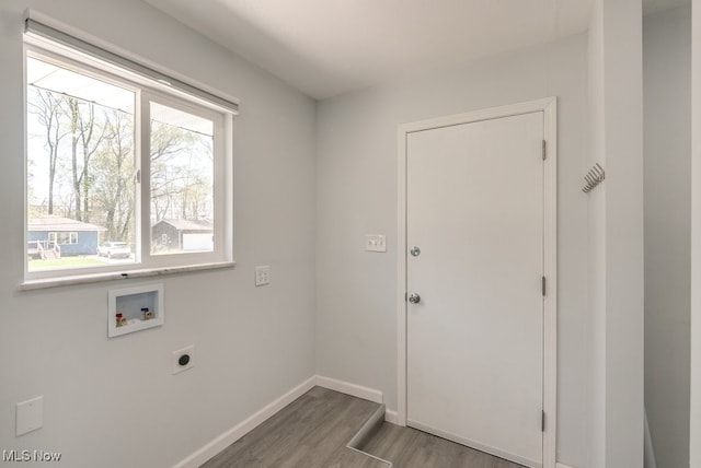 laundry room featuring electric dryer hookup, wood finished floors, hookup for a washing machine, and baseboards