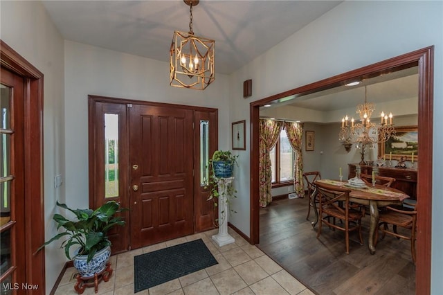 3286 Marks Rd, Medina, OH 44256 - foyer entrance featuring a chandelier, light tile patterned flooring, and baseboards