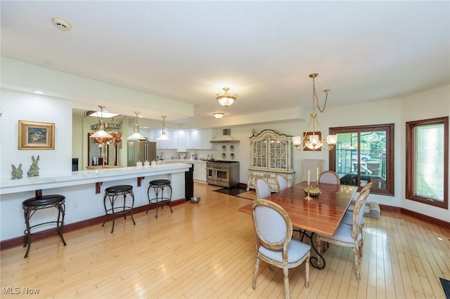 3286 Marks Rd, Medina, OH 44256 - dining area featuring light wood finished floors, baseboards, and a chandelier