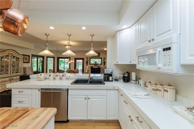 3286 Marks Rd, Medina, OH 44256 - kitchen featuring a sink, white microwave, stainless steel dishwasher, recessed lighting, and a peninsula
