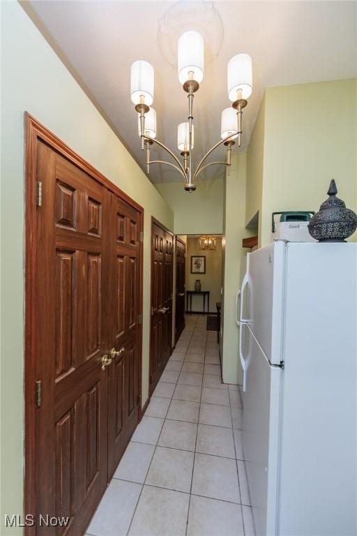 3286 Marks Rd, Medina, OH 44256 - hallway with light tile patterned floors and a chandelier