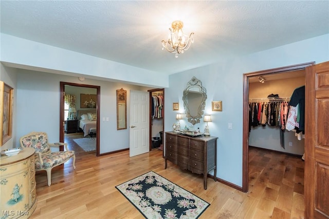3286 Marks Rd, Medina, OH 44256 - entrance foyer with light wood-style flooring, a chandelier, and baseboards