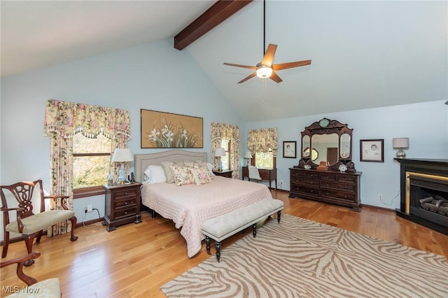 3286 Marks Rd, Medina, OH 44256 - bedroom featuring beamed ceiling, high vaulted ceiling, wood finished floors, a fireplace, and ceiling fan
