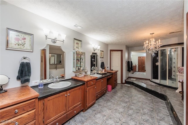 3286 Marks Rd, Medina, OH 44256 - bathroom with a chandelier, vanity, and a textured ceiling