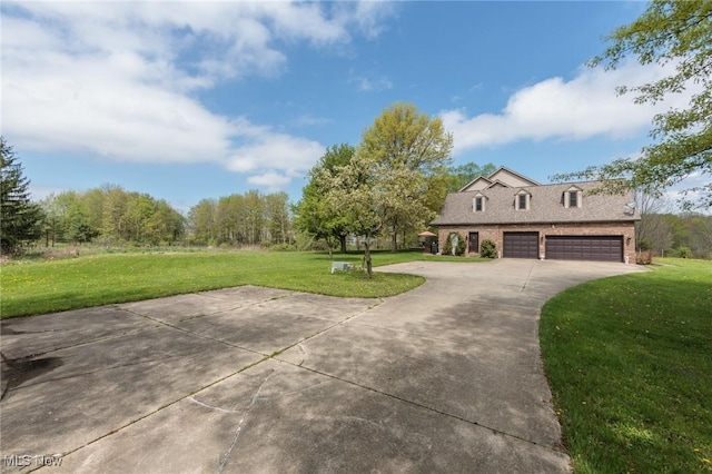 3286 Marks Rd, Medina, OH 44256 - view of front of house featuring concrete driveway, a front lawn, brick siding, and a garage