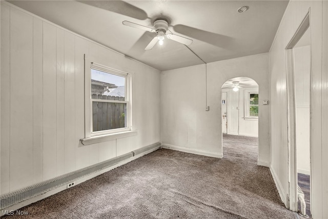 5403 Merkle Ave, Parma, OH 44129 - carpeted spare room with a ceiling fan, baseboard heating, arched walkways, and baseboards
