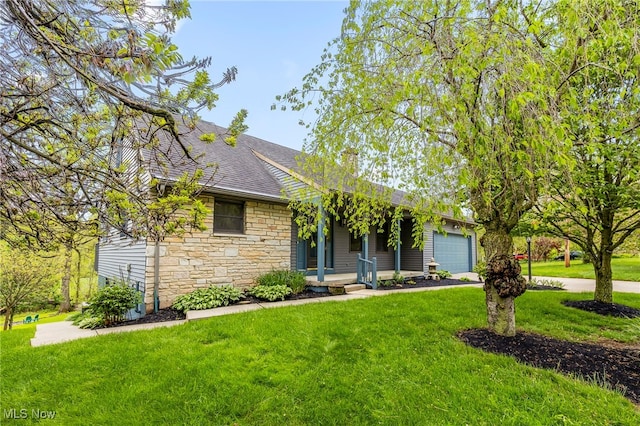 single story home featuring stone siding, an attached garage, a front yard, and roof with shingles