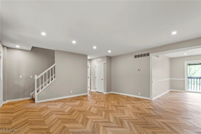 basement with recessed lighting, stairs, and baseboards