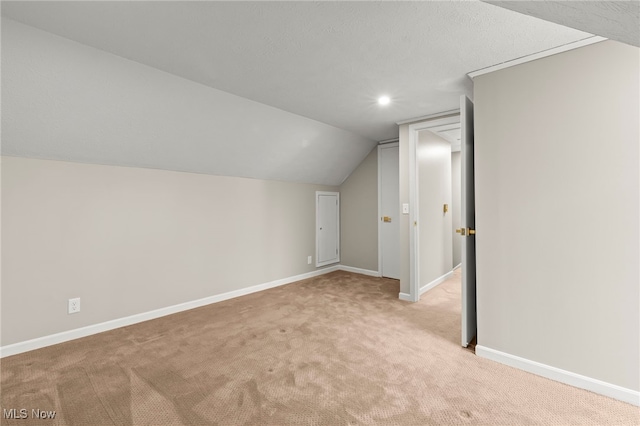 bonus room with light colored carpet, baseboards, lofted ceiling, and recessed lighting