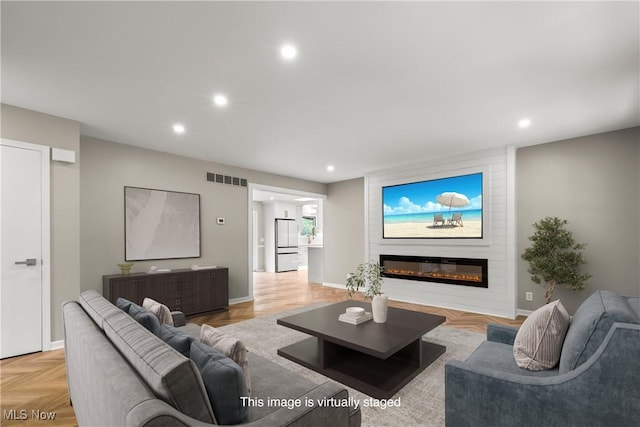 living room with recessed lighting, a large fireplace, and baseboards