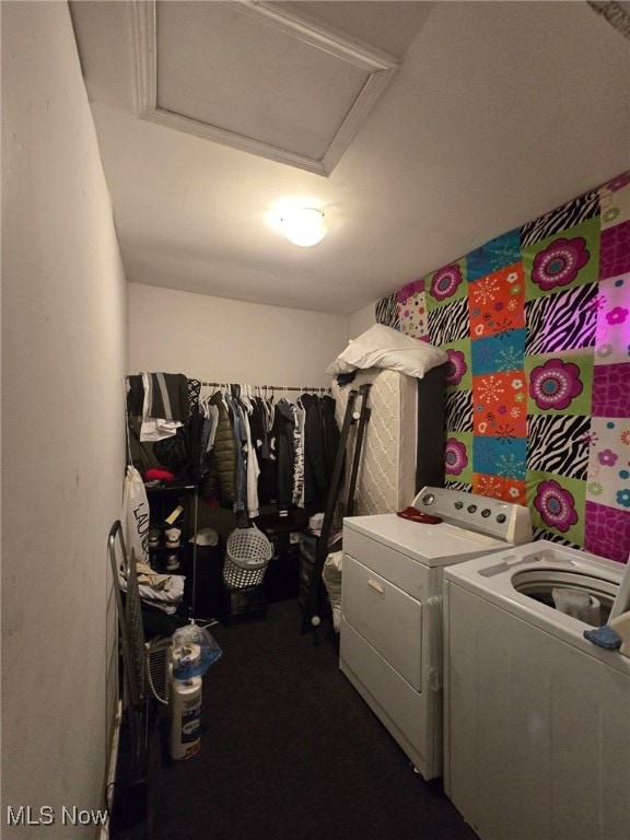 laundry area featuring independent washer and dryer and attic access