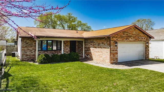 312 58th St, Vienna, WV 26105 - single story home featuring an attached garage, brick siding, concrete driveway, and cooling unit