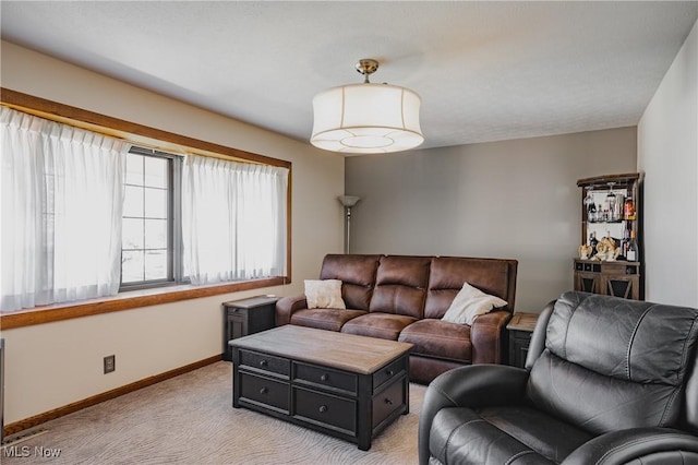 312 58th St, Vienna, WV 26105 - living room featuring light carpet and baseboards
