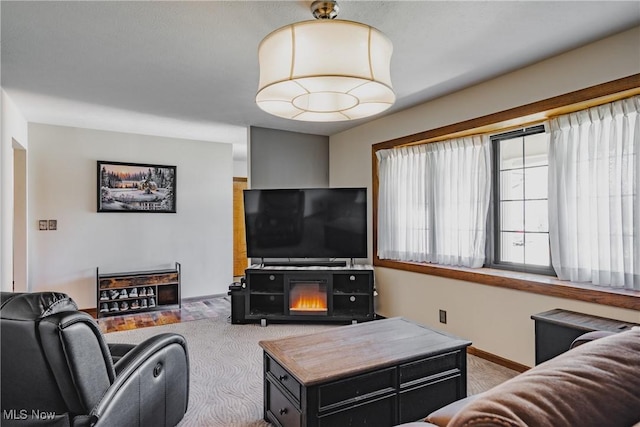 312 58th St, Vienna, WV 26105 - living room featuring baseboards and carpet floors