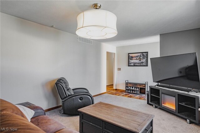 312 58th St, Vienna, WV 26105 - living room with light colored carpet and baseboards