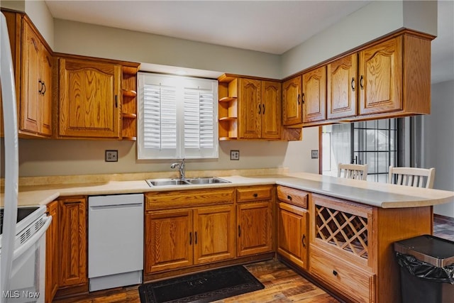 312 58th St, Vienna, WV 26105 - kitchen with white appliances, open shelves, a sink, brown cabinets, and a peninsula