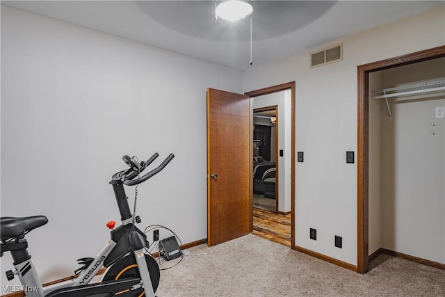 312 58th St, Vienna, WV 26105 - exercise room featuring a ceiling fan, light carpet, and baseboards