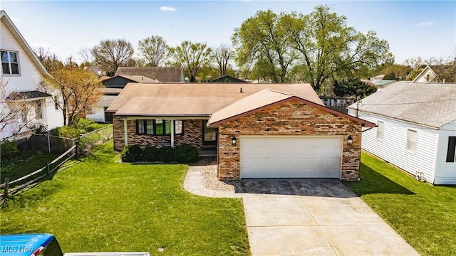 312 58th St, Vienna, WV 26105 - view of front of home with brick siding and concrete driveway