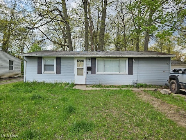ranch-style house with a front yard