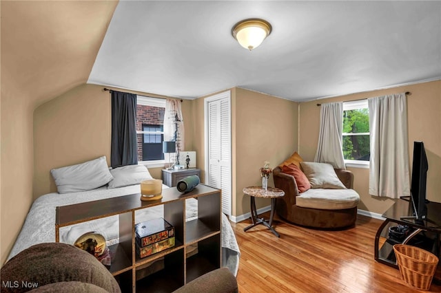 2508 Ashurst Rd, University Heights, OH 44118 - bedroom with wood finished floors, a closet, and baseboards