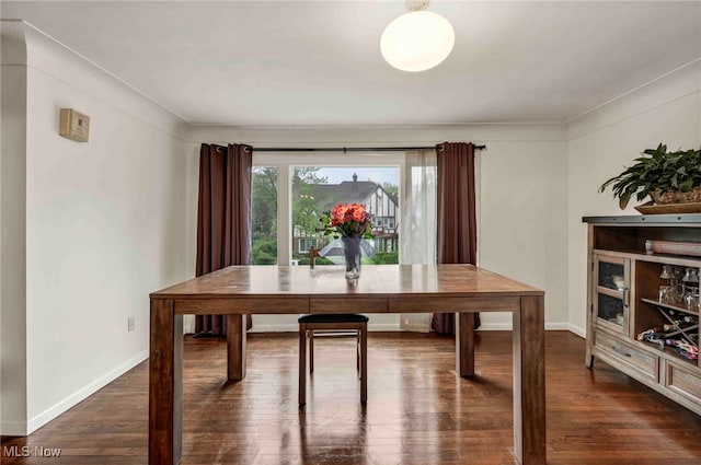 2508 Ashurst Rd, University Heights, OH 44118 - dining room featuring dark wood-style floors and baseboards