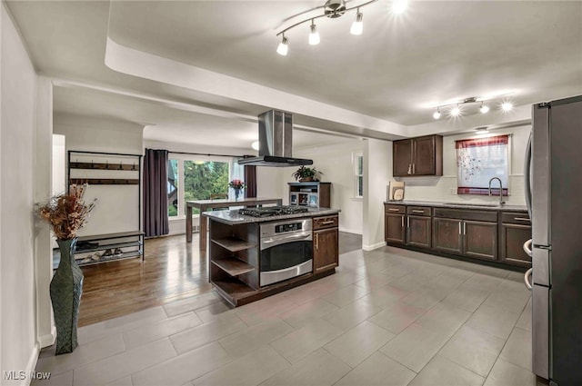 2508 Ashurst Rd, University Heights, OH 44118 - kitchen with appliances with stainless steel finishes, extractor fan, a sink, dark brown cabinetry, and baseboards