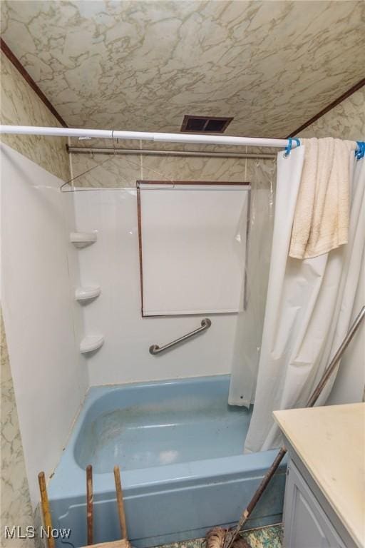 full bathroom with shower / bathtub combination with curtain and vanity