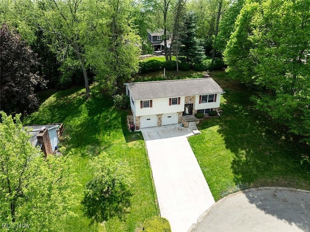 view of subject property with a heavily wooded area