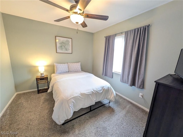 carpeted bedroom featuring baseboards and a ceiling fan