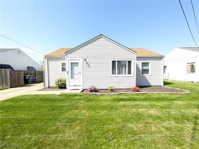 rear view of property with a shingled roof