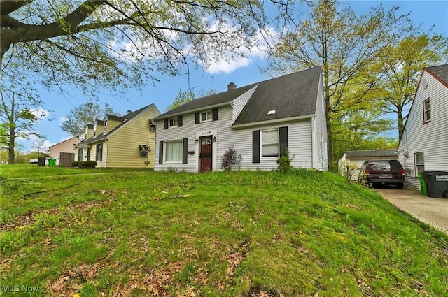 19519 Meadowlark Ln, Warrensville Heights, OH 44128 - view of front of home with a chimney and a front lawn