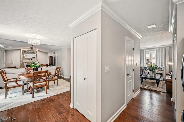 4815 Shadow Oak Dr, Austintown, OH 44515 - hallway with a textured ceiling, dark wood-type flooring, baseboards, and ornamental molding