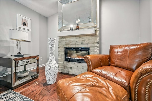4815 Shadow Oak Dr, Austintown, OH 44515 - living room featuring wood finished floors, baseboards, and a fireplace
