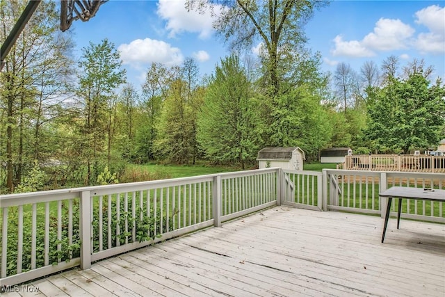 4815 Shadow Oak Dr, Austintown, OH 44515 - wooden deck featuring a storage shed and an outdoor structure