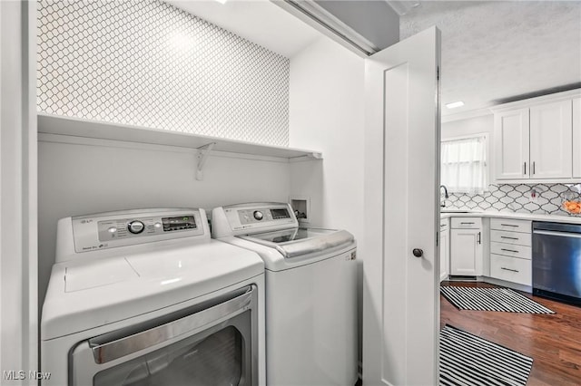 4815 Shadow Oak Dr, Austintown, OH 44515 - laundry area with washer and clothes dryer and wood finished floors