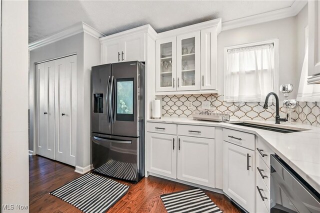 4815 Shadow Oak Dr, Austintown, OH 44515 - kitchen with stainless steel appliances, crown molding, backsplash, white cabinetry, and glass insert cabinets