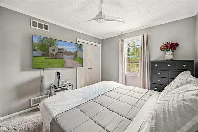 4815 Shadow Oak Dr, Austintown, OH 44515 - carpeted bedroom with a textured ceiling, crown molding, baseboards, a closet, and a ceiling fan