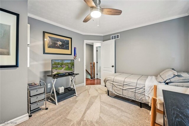 4815 Shadow Oak Dr, Austintown, OH 44515 - carpeted bedroom featuring ornamental molding, baseboards, and ceiling fan